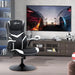Black and white faux leather gaming chair with flip-up armrests in modern living room