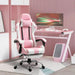 Pink and white gaming chair with footrest and cushions in a modern pink gaming setup.