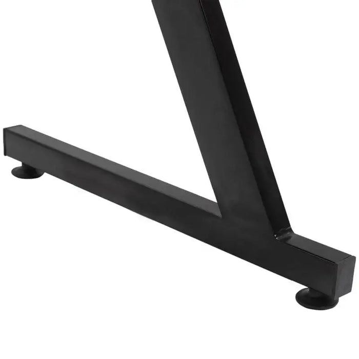 Close-up of black Z-shape gaming desk frame with sturdy metal legs