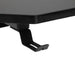 Black gaming desk headphone hook detail on carbon fiber textured surface