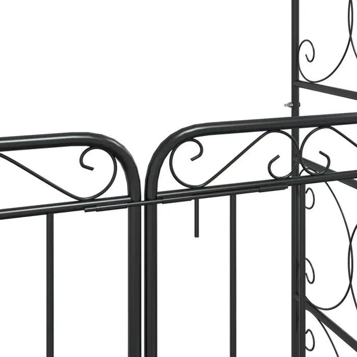 Black powder coated steel garden arch with gate and decorative scrollwork details