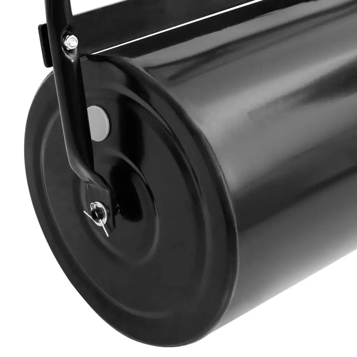 Close-up of a black heavy duty iron lawn roller with metal handle for gardens
