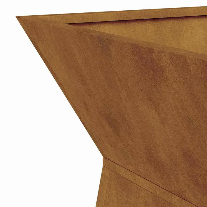 Close-up of a rust-colored weathering steel garden pillar planter with angular design
