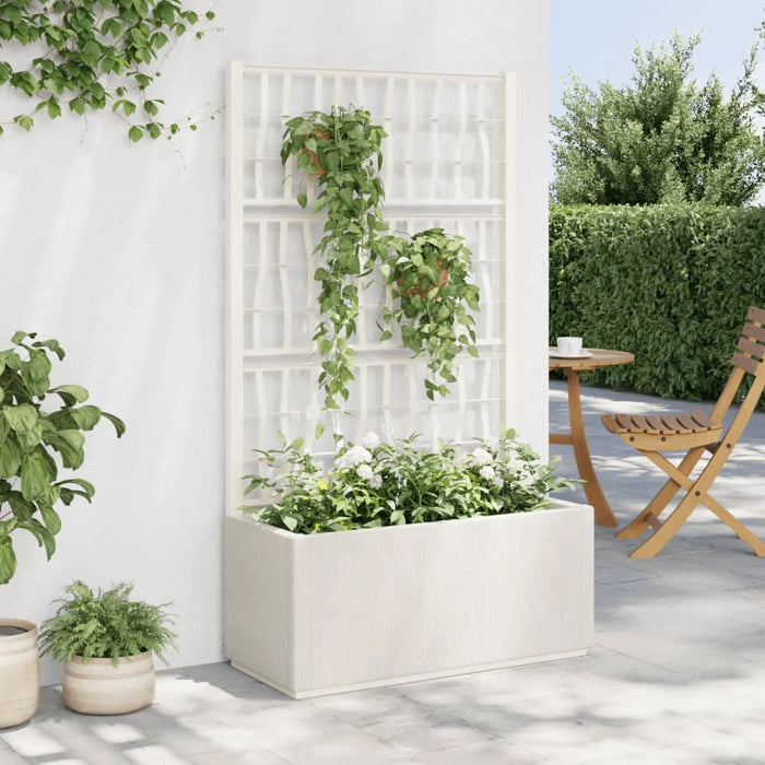 White polypropylene raised garden planter with trellis supporting climbing plants, outdoor patio setting with wooden chair and table