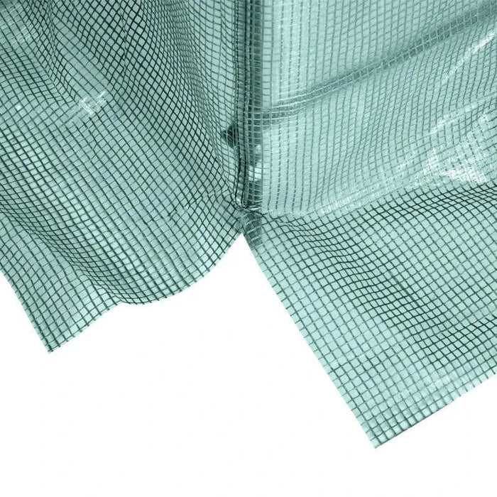 Close-up of green mesh polytunnel greenhouse cover with reinforced grid design