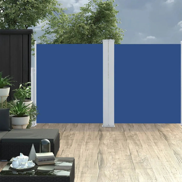 Blue double-sided retractable garden privacy screen on a wooden patio with outdoor furniture