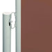 Brown retractable garden side awning with metal posts and privacy screen