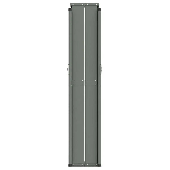 Brown retractable garden side awning closed, shown vertically with metal handles