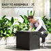 Young man assembling black waterproof outdoor garden storage box in bright sunlit patio with green plants