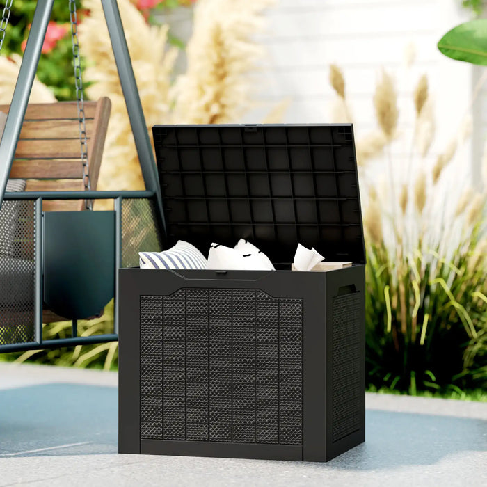 Black waterproof outdoor garden storage box with open lid and cushions inside near patio swing