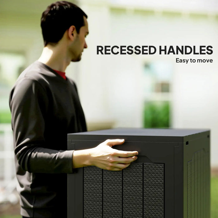 Man moving black waterproof outdoor garden storage box with recessed handles in sunny backyard