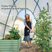 Woman watering plants inside a greenhouse with text 'Enjoy the joy of planting and harvest'.