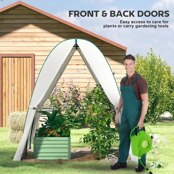 Man standing next to a garden arch with plants and a wooden shed in the background