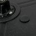 Close-up of black textured surface with circular knob and metal screw detail