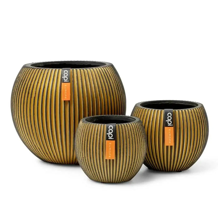 Set of three gold groove ball vases with natural rock-inspired textured finish