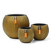 Set of three gold groove ball vases with natural rock-inspired textured finish