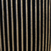 Close-up of black and gold grooved vase texture with vertical striped pattern