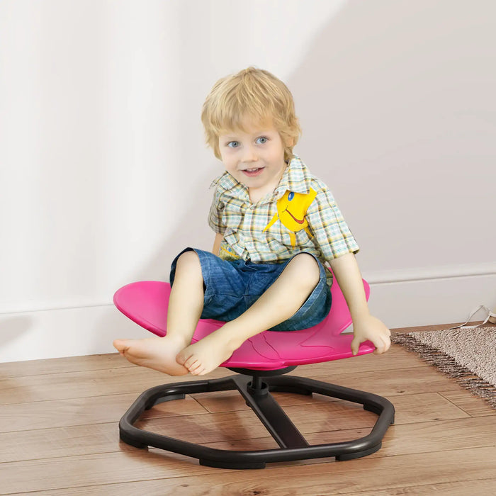 Child sitting on a pink and black chair indoors