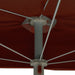 Half round garden parasol close-up with terracotta canopy and white metal frame
