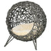 Hand-woven rattan cat house with cushion and tripod legs, elevated wicker cat basket