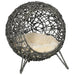 Hand-woven rattan cat house with tripod legs and a beige cushion, elevated wicker basket