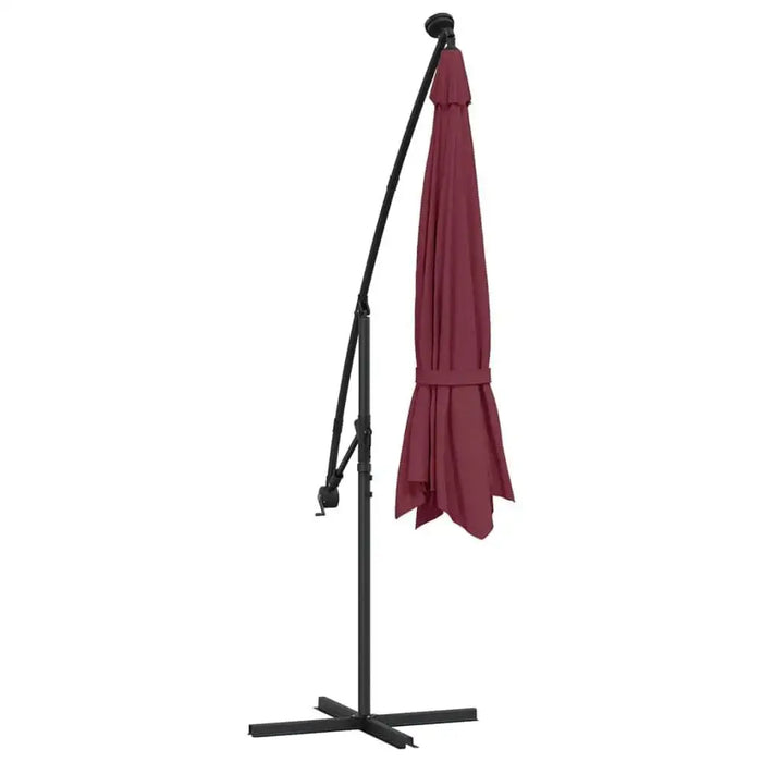 Bordeaux red hanging parasol with black stand, closed and upright on white background