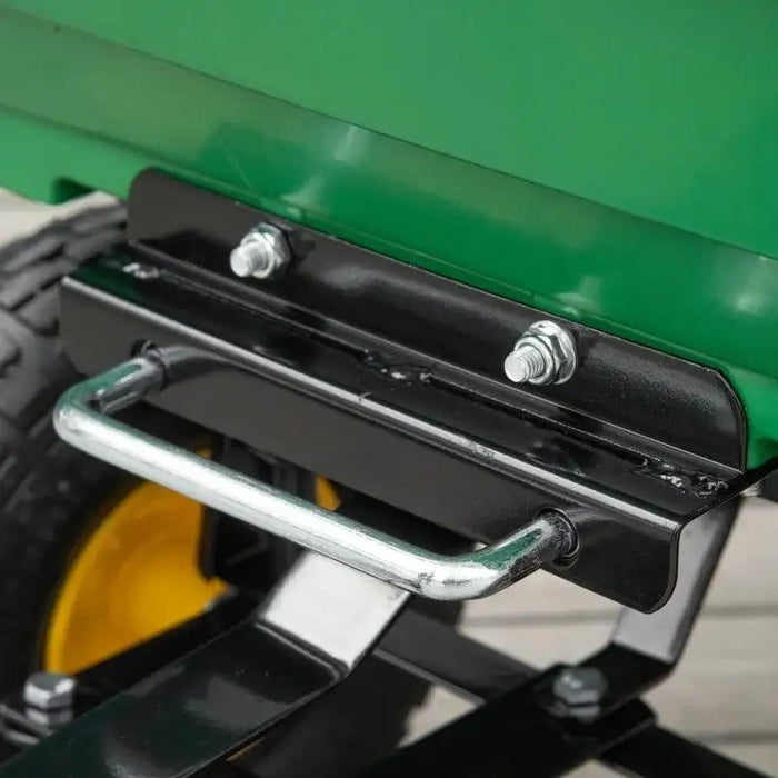 Heavy duty garden dump cart green metal frame, close-up of wheelbarrow handle and bolts