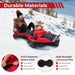 Two people sledding on a red and black inflatable snow tube on a snowy hill with winter gear