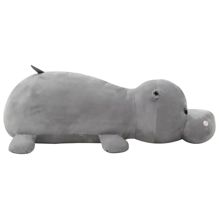 Large grey plush hippo cuddly toy lying on white background, soft cotton filled