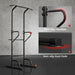 Black pull-up bar with non-slip handles and foot pads on a gray background