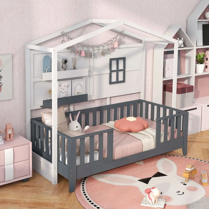 Children's room with a gray house-shaped bed, pink bedding, and toys.