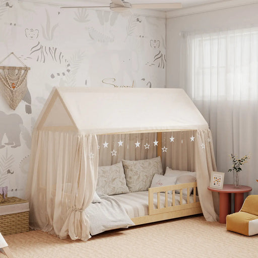 Children's room with a bed canopy and decorative wall art