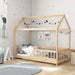 Children's room with a wooden house-shaped bed, colorful wall decorations, and toys.