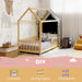 Children's room with a wooden house-shaped bed, string lights, and decorative elements.