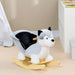 Grey and black plush husky rocking horse with wooden rocker in a child's room