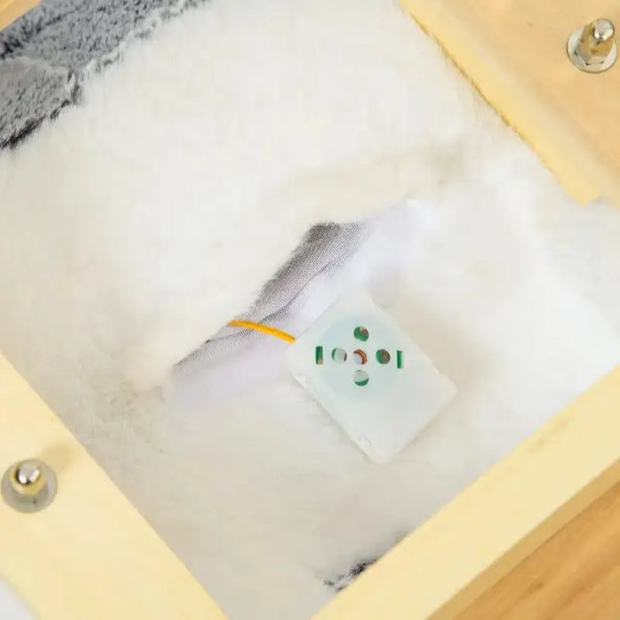 Close-up of plush husky rocking horse underside showing sound box and wooden frame