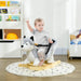 Toddler riding grey plush husky rocking horse on wooden rocker in bright playroom