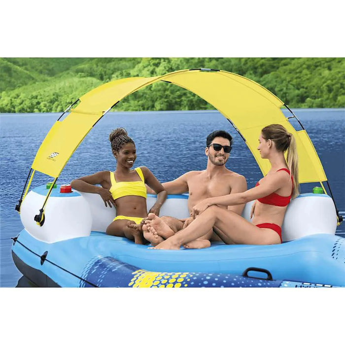 Three people relaxing on a Hydro Force luxury floating lounger with sun canopy on a lake