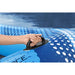 Hand holding handle on blue Hydro Force inflatable floating lounger on water