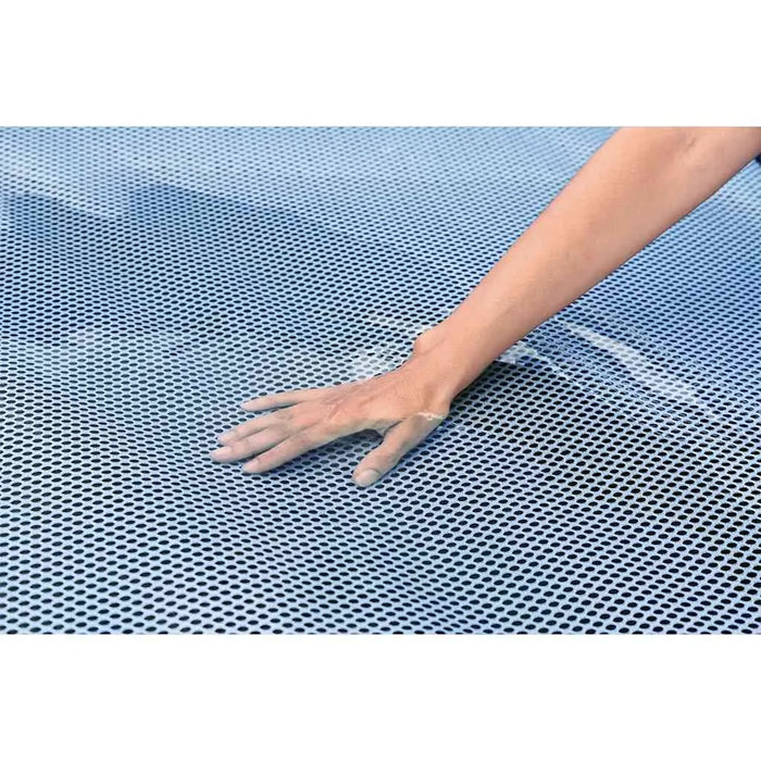 Hand touching blue mesh fabric on Hydro Force floating lounger surface