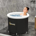 Woman in an Outsunny inflatable ice tub for cold plunge therapy in modern bathroom
