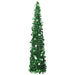 Tall green tinsel Christmas tree decorated with shiny green circular ornaments on white background