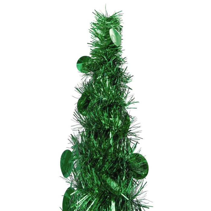 Close-up of green metallic tinsel garland with shiny round sequins on white background