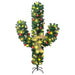 Cactus-shaped Christmas tree decorated with red and gold ornaments, yellow lights, and a gold bow