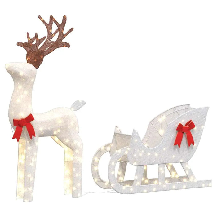 Christmas reindeer and sleigh decoration with white lights and red bows