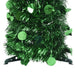 Close-up of green tinsel holiday garland with metallic round confetti decorations on plastic stand