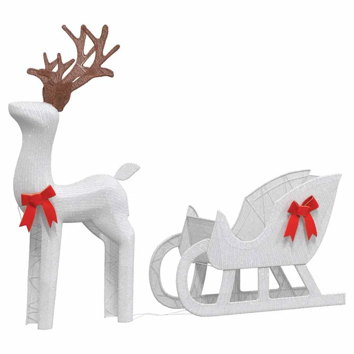 White Christmas reindeer and sleigh decorations with red bows and sparkling texture