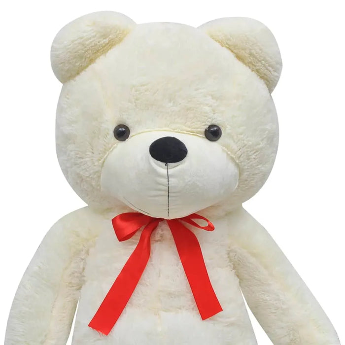 White teddy bear with a red bow on a white background