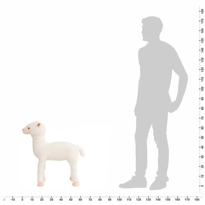 White plush lamb toy next to a silhouette of a person with a measurement scale on a white background