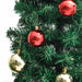 Green Christmas tree decorated with shiny red and gold baubles